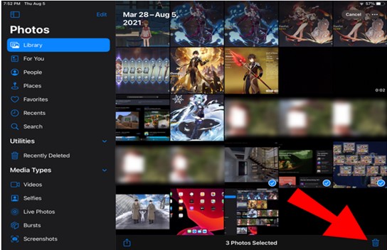 tap the trash icon and confirm to delete all photos from ipad
